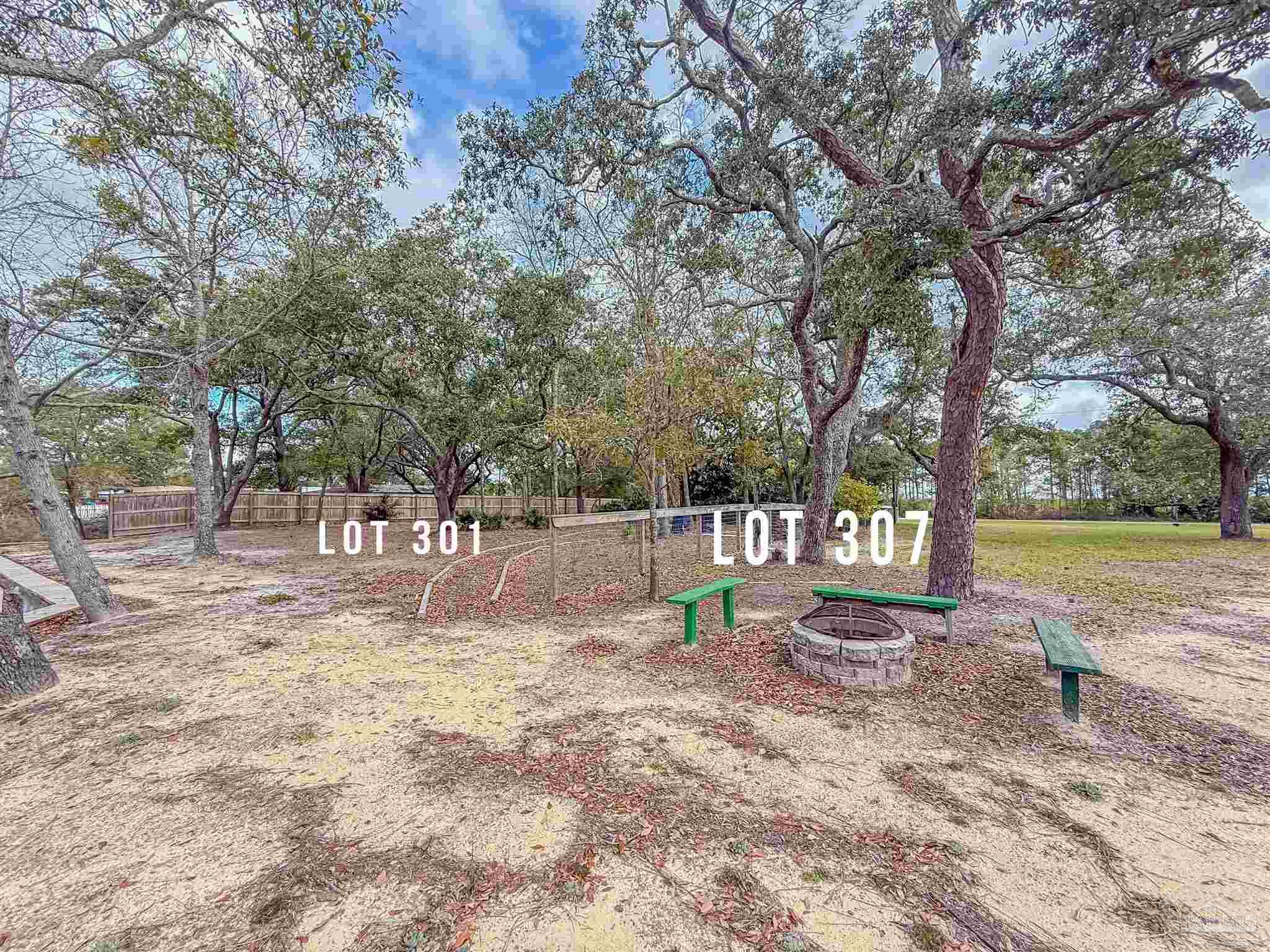 307 Katie Street Milton, FL 32583 - Photo 15 of 17 a view of backyard with tree