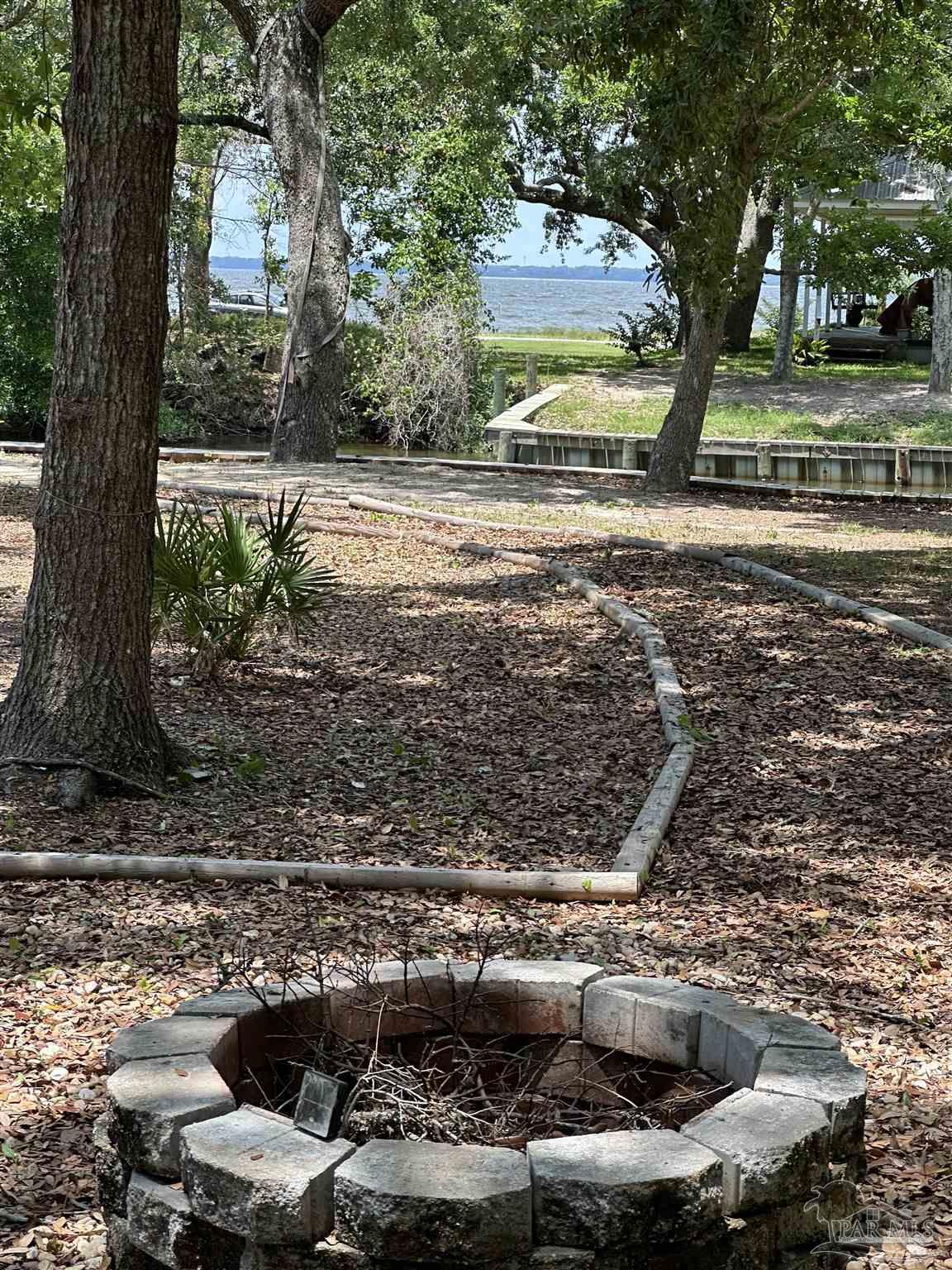 307 Katie Street Milton, FL 32583 - Photo 17 of 17 a view of a yard with an outdoor space
