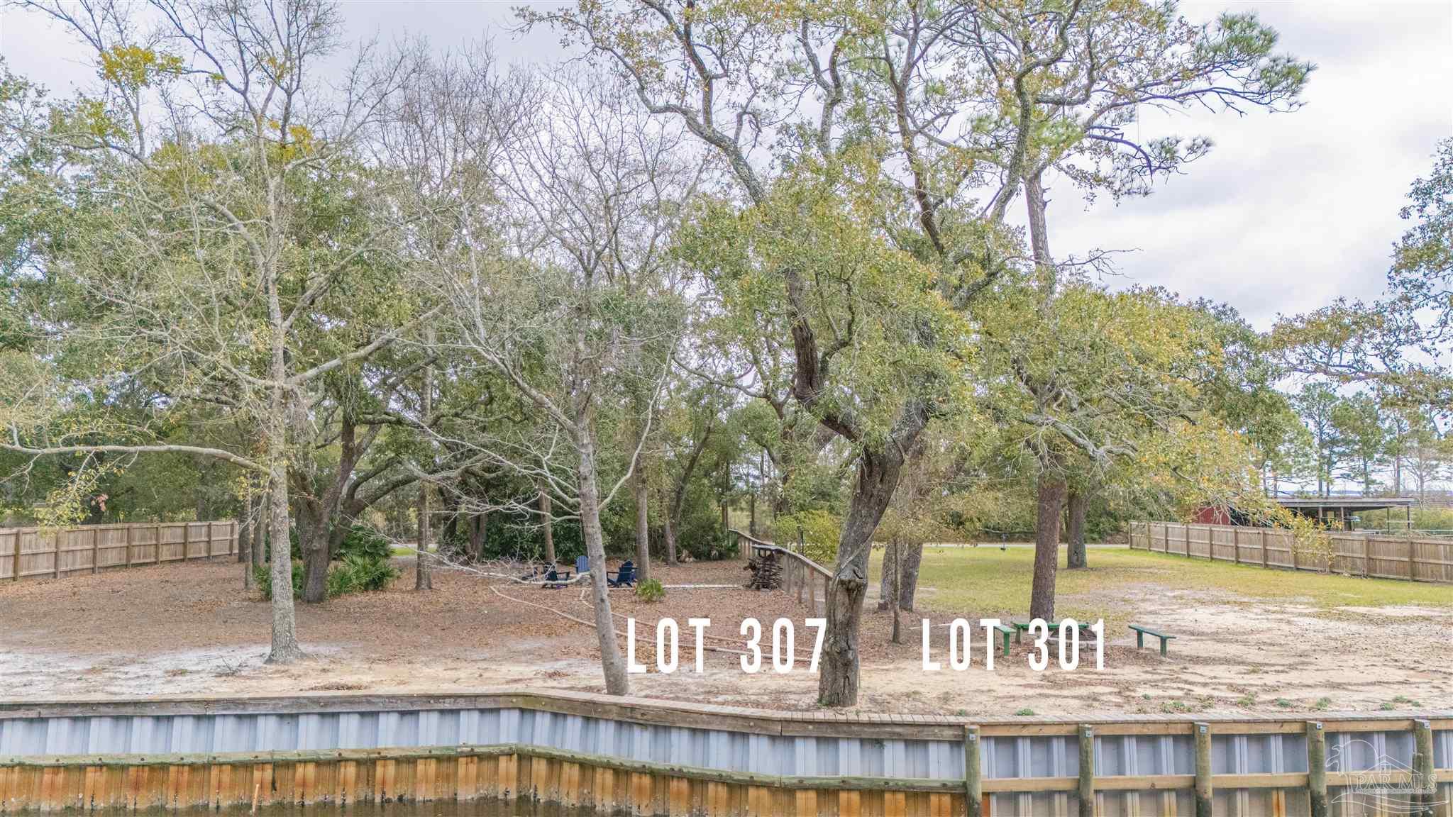307 Katie Street Milton, FL 32583 - Photo 2 of 17 a view of a park with large trees