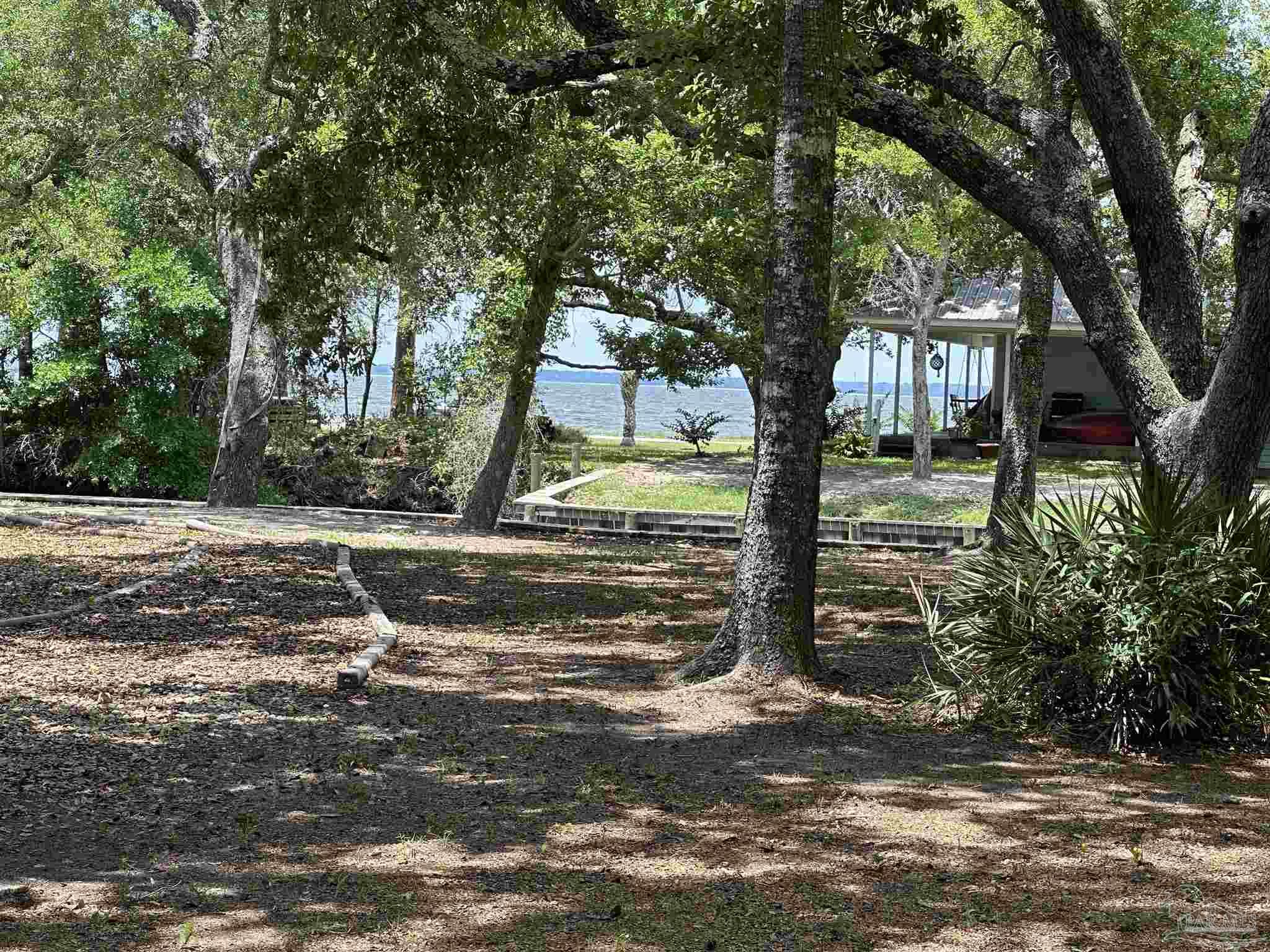 307 Katie Street Milton, FL 32583 - Photo 3 of 17 a view of backyard with green space