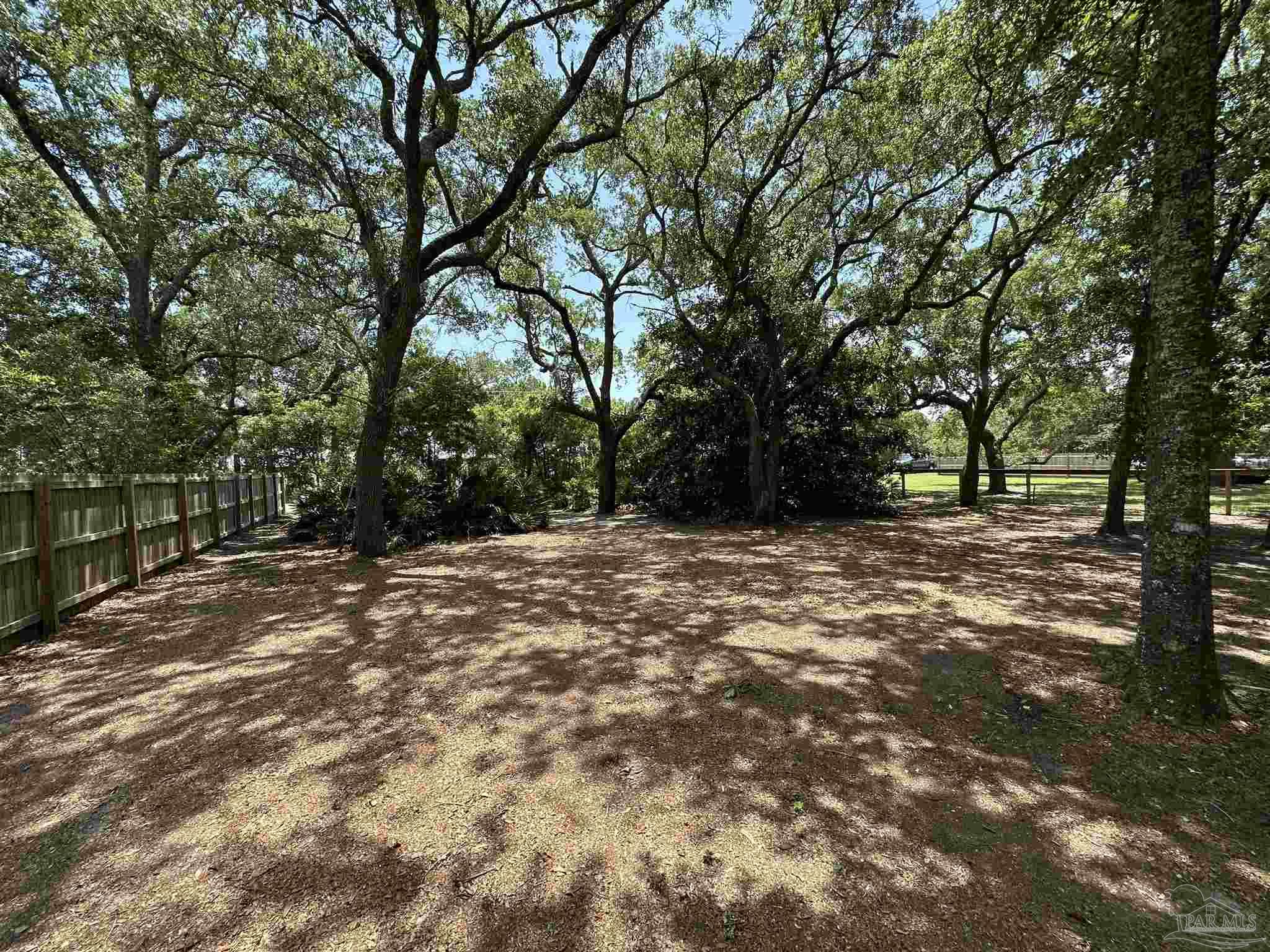 307 Katie Street Milton, FL 32583 - Photo 4 of 17 a view of outdoor space with trees