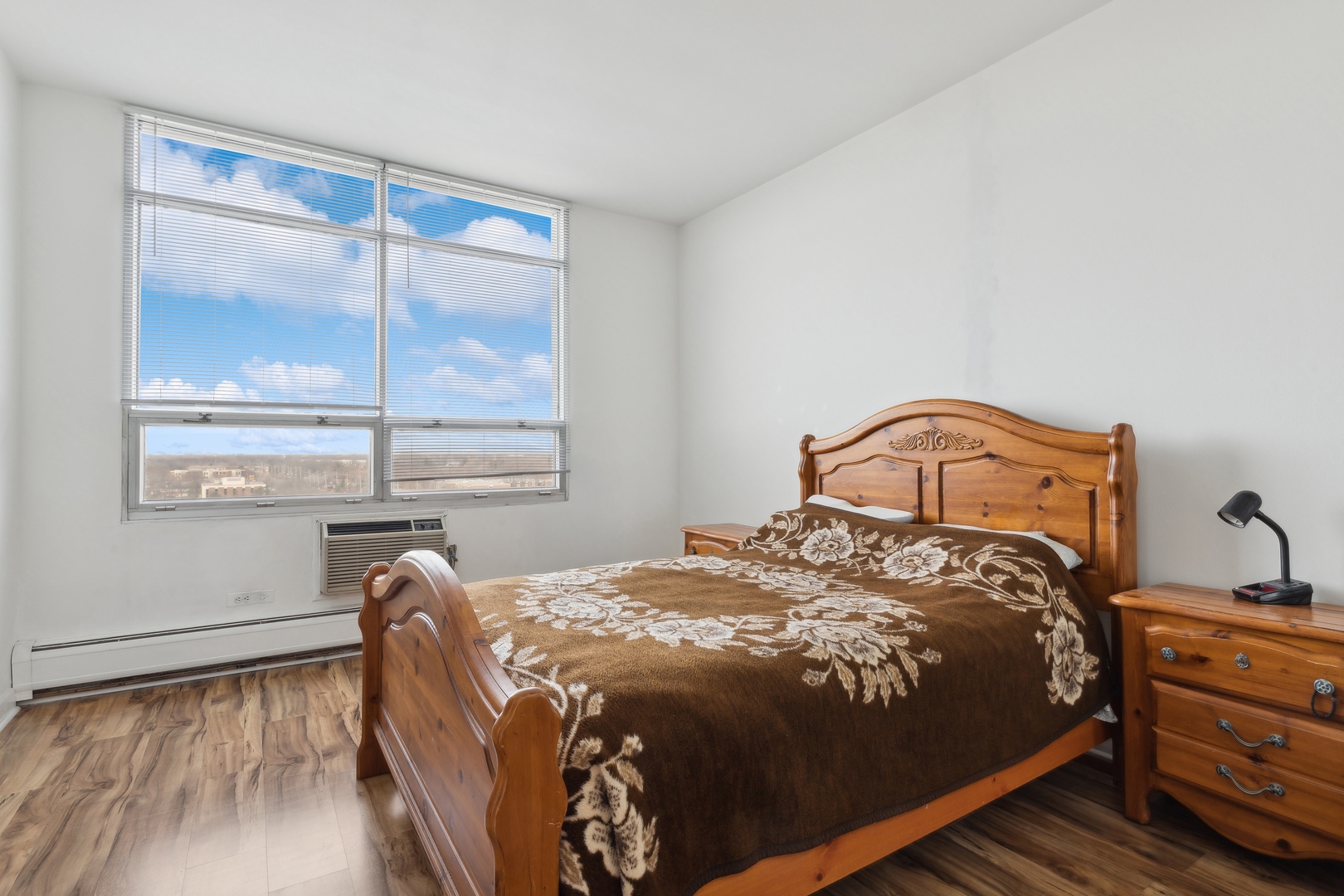9009 Golf Road, Unit 10F Des Plaines, IL 60016 - Photo 14 of 17 a bedroom with a bed and a window