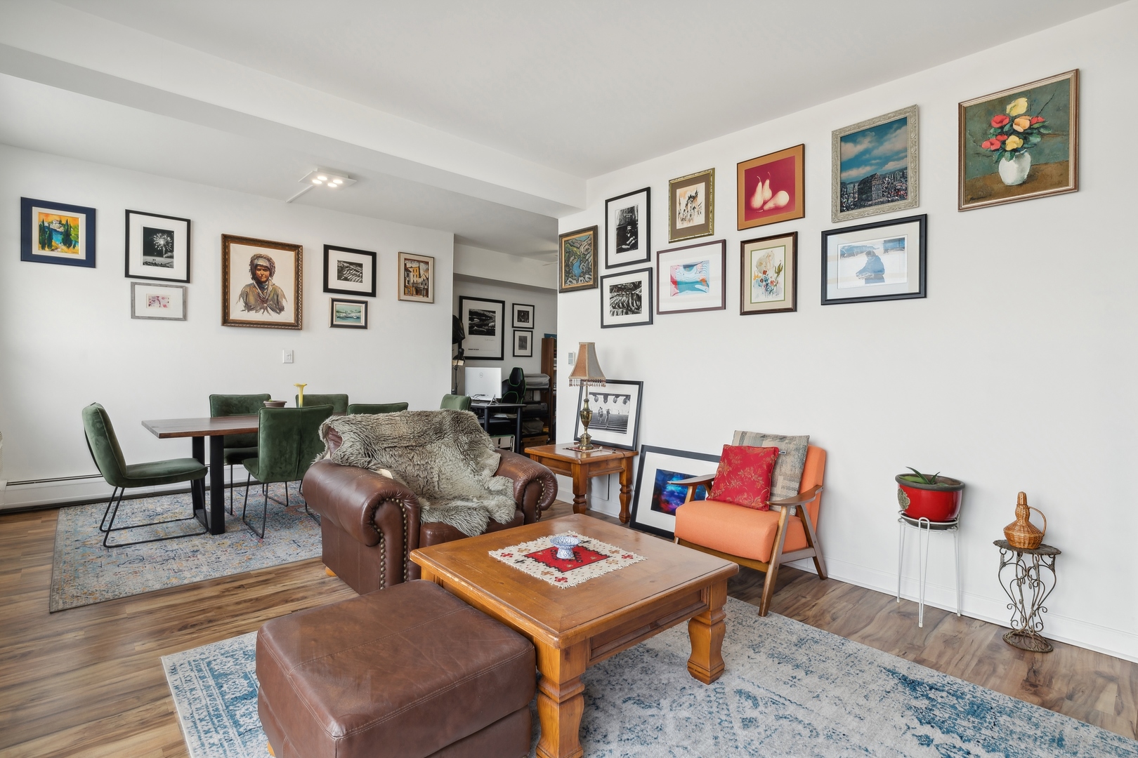 9009 Golf Road, Unit 10F Des Plaines, IL 60016 - Photo 6 of 17 a living room with furniture and a wooden floor