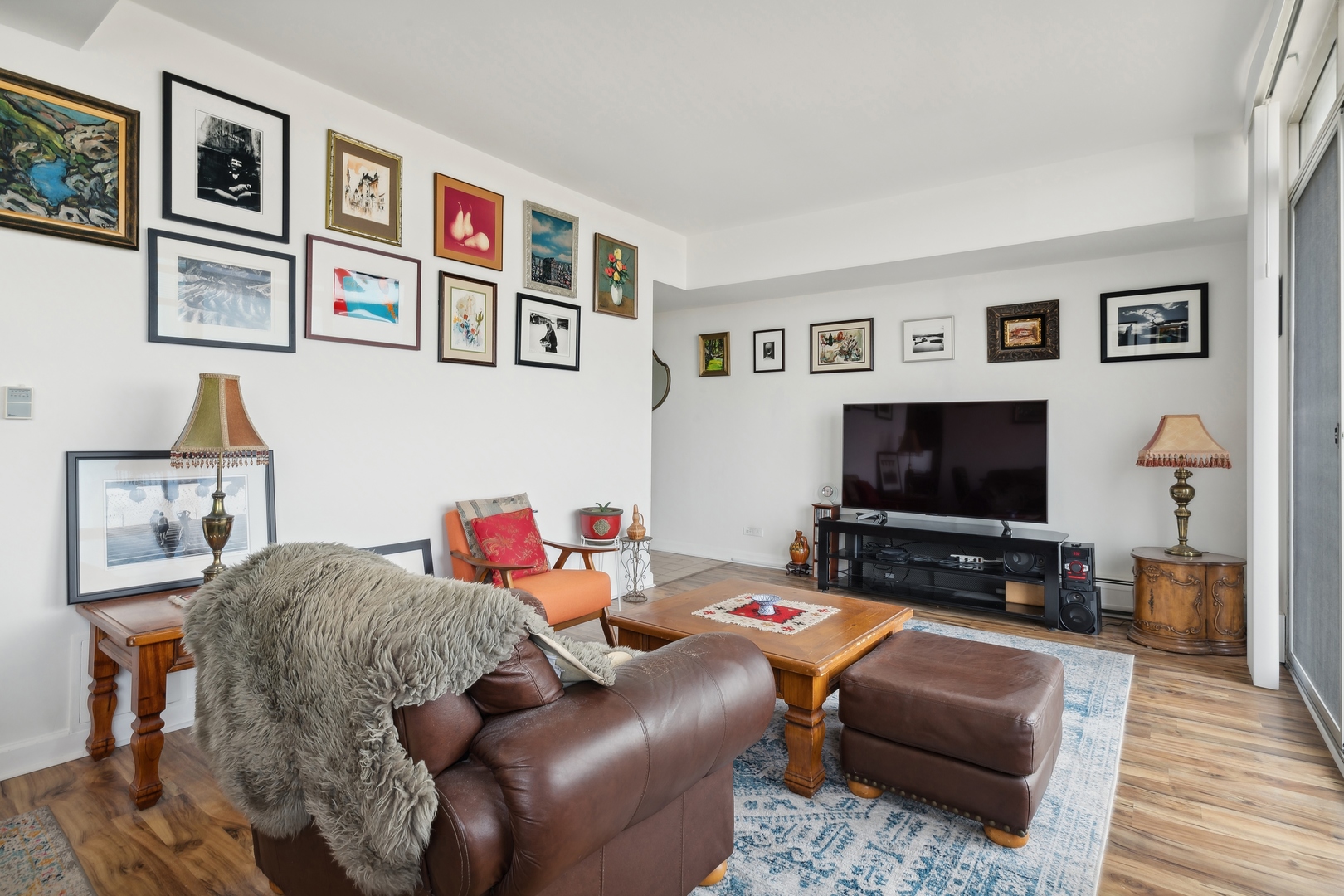 9009 Golf Road, Unit 10F Des Plaines, IL 60016 - Photo 7 of 17 a living room with furniture and a flat screen tv