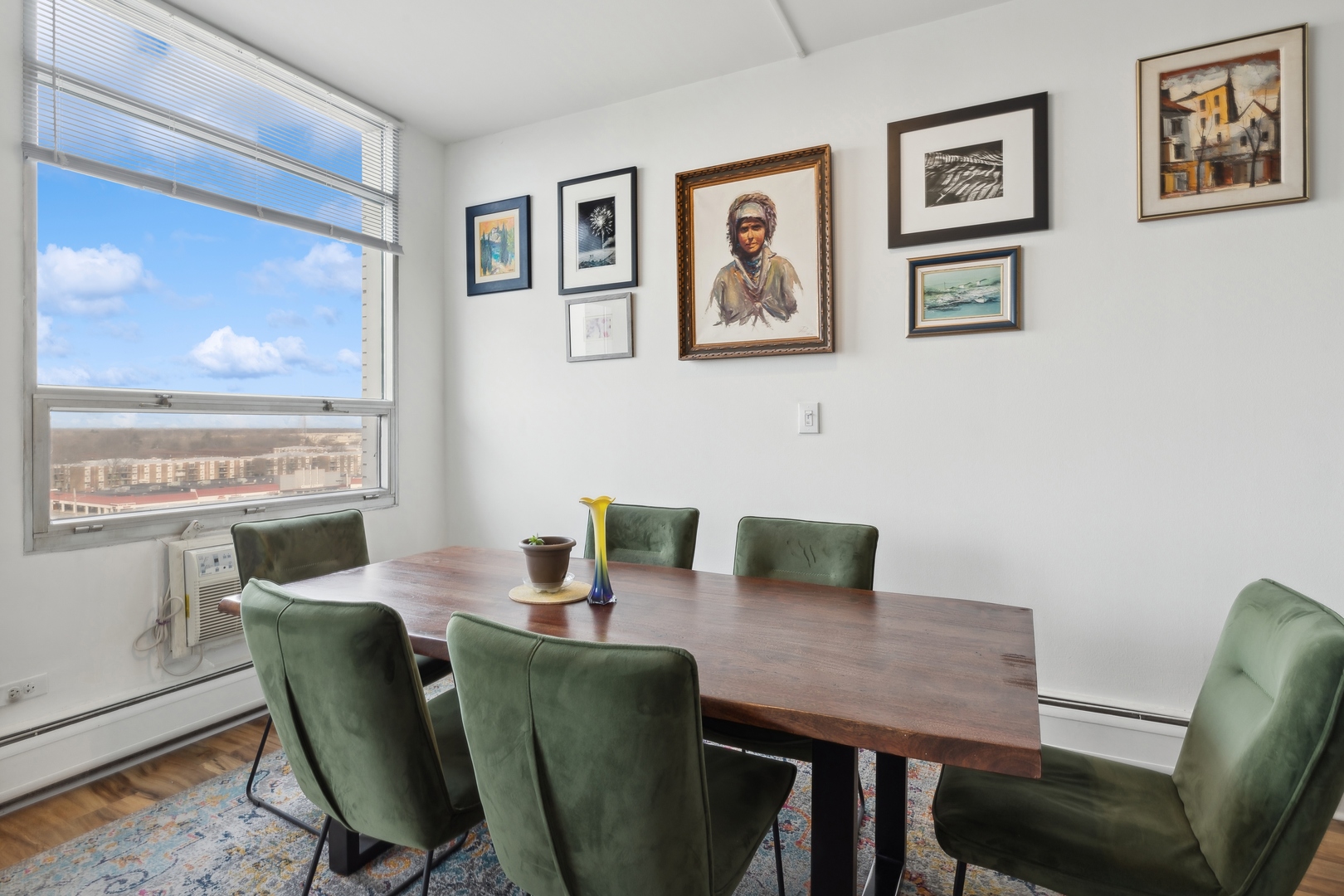 9009 Golf Road, Unit 10F Des Plaines, IL 60016 - Photo 10 of 17 a view of a dining room with furniture window and wooden floor