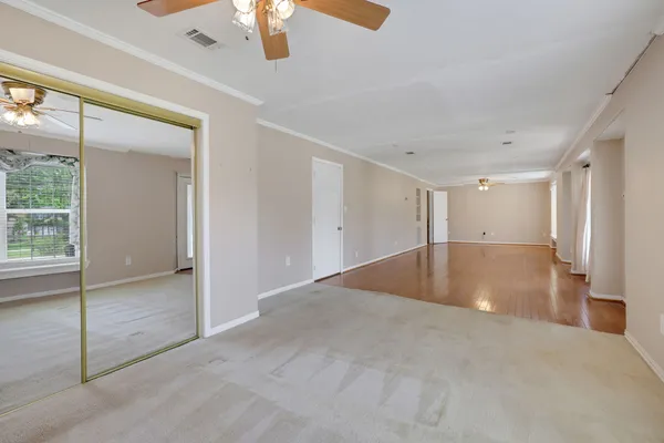 a view of an empty room with a window