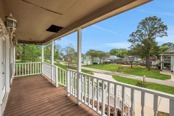 a view of a porch with wooden floor and outdoor space