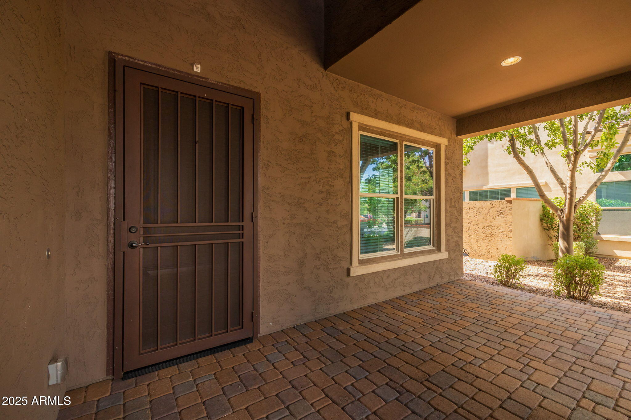 10535 Diffraction Avenue Mesa, AZ 85212 - Photo 16 of 126 a view of an empty room with a window and wooden floor