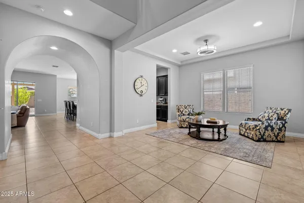 a spacious kitchen with stainless steel appliances a sink and cabinets