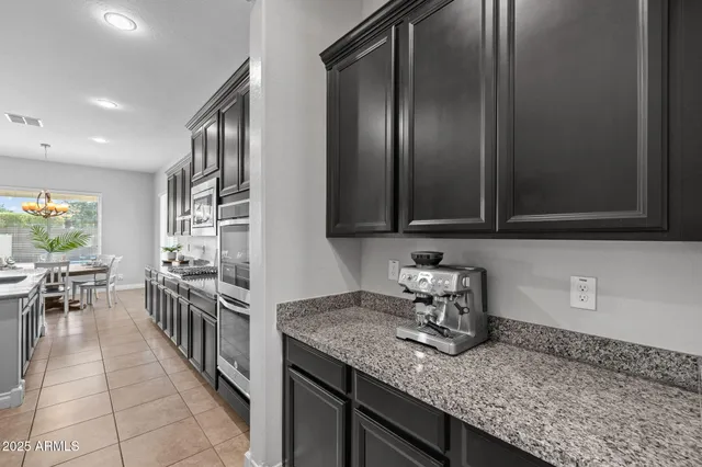 a utility room with multiple dryer and washer