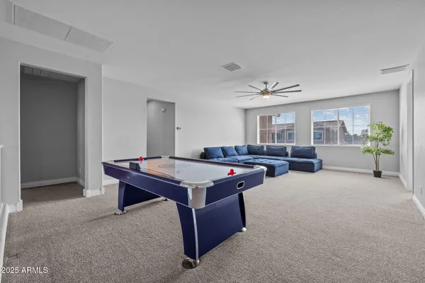 a view of a swimming pool with outdoor seating