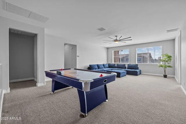 a view of a swimming pool with outdoor seating