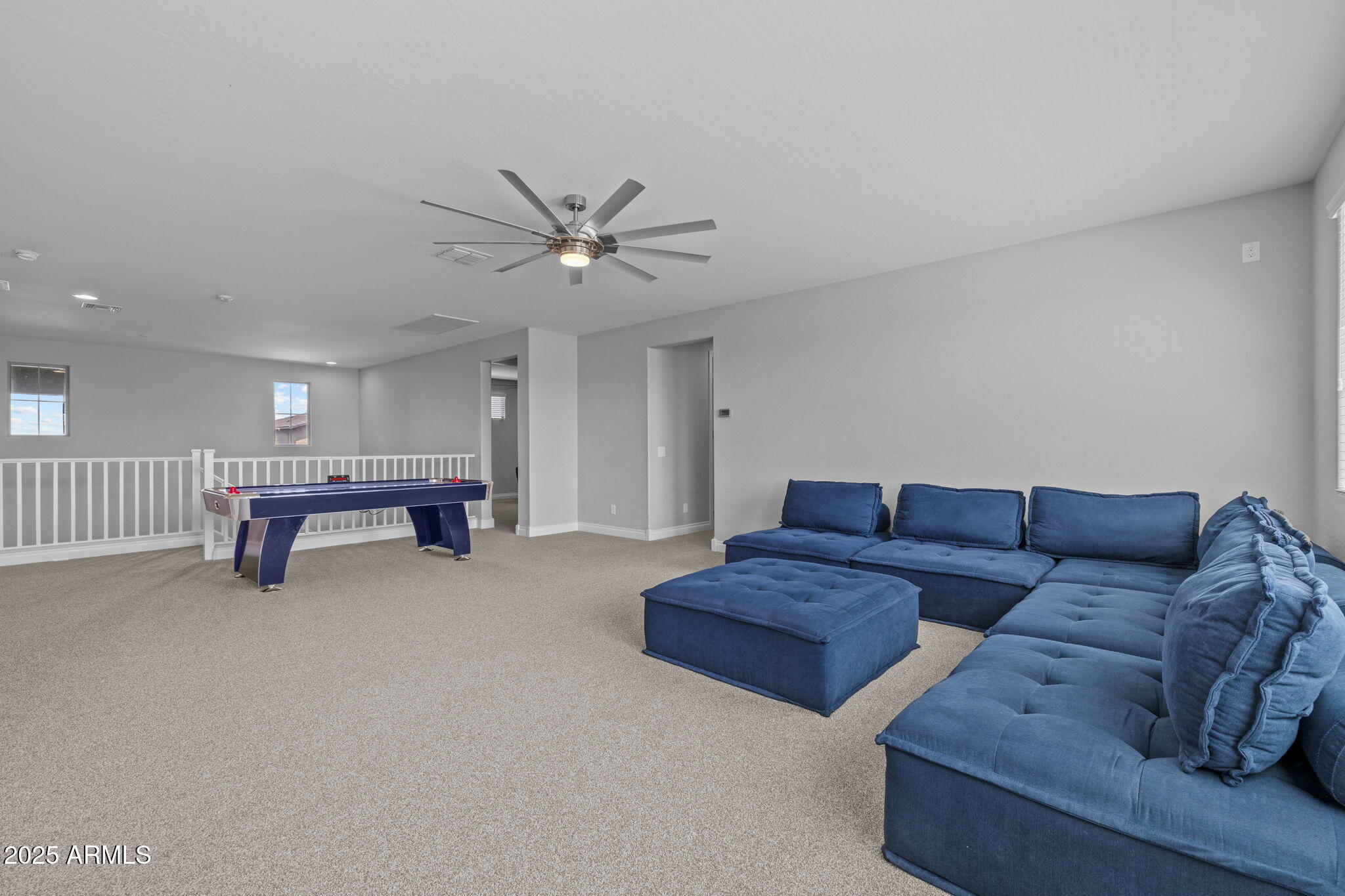 10535 Diffraction Avenue Mesa, AZ 85212 - Photo 40 of 126 a living room with furniture and a window