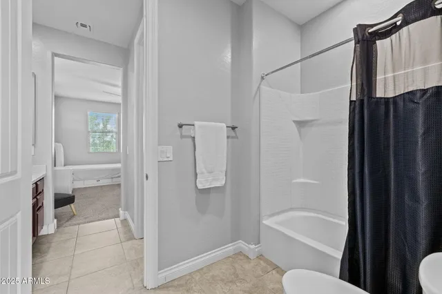 a view of a swimming pool with a table and chairs