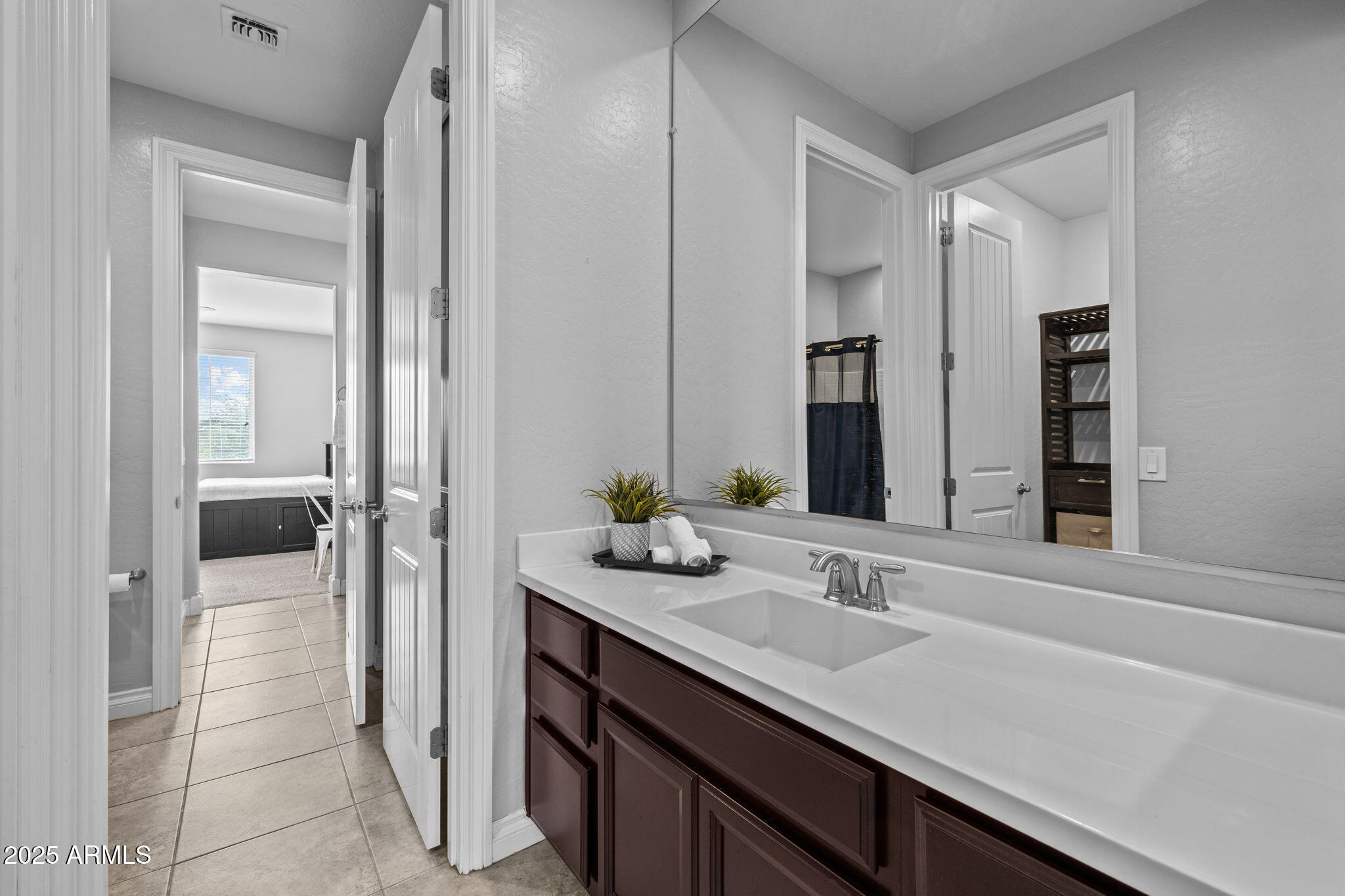 10535 Diffraction Avenue Mesa, AZ 85212 - Photo 48 of 126 a bathroom with a sink and a mirror