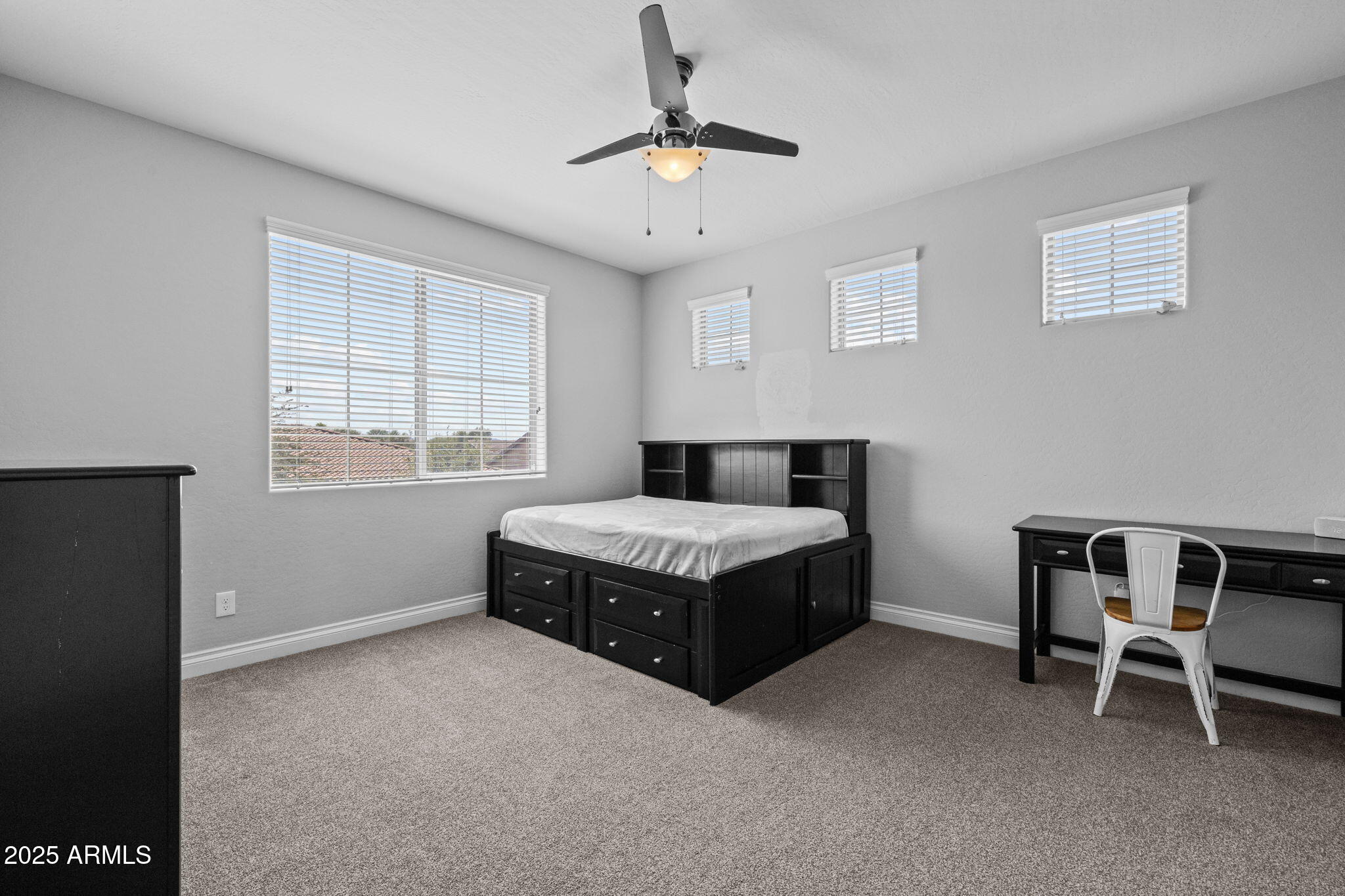 10535 Diffraction Avenue Mesa, AZ 85212 - Photo 49 of 126 a bedroom with a bed and a table in it