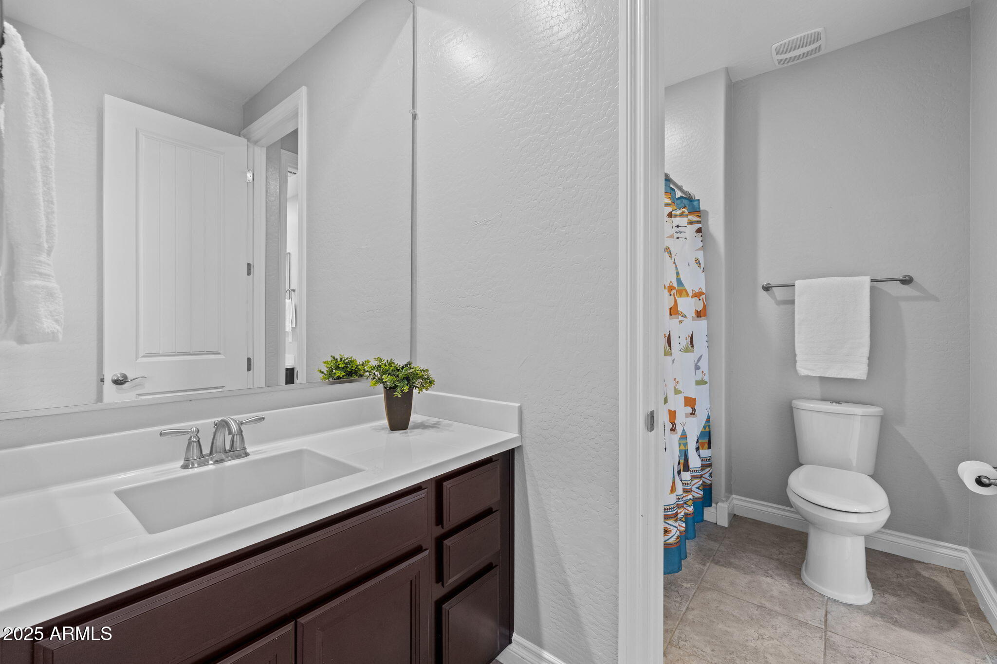10535 Diffraction Avenue Mesa, AZ 85212 - Photo 50 of 126 a bathroom with a sink toilet and shower