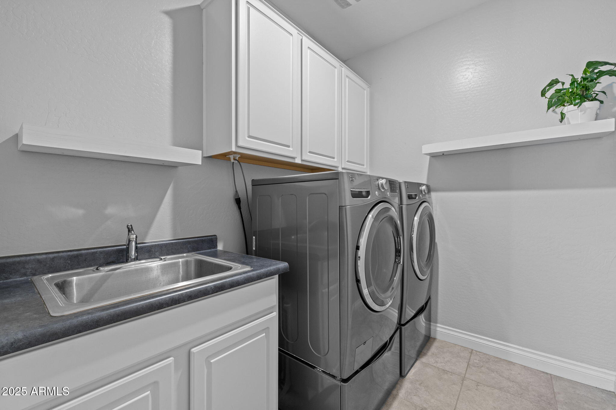 10535 Diffraction Avenue Mesa, AZ 85212 - Photo 55 of 126 a utility room with multiple dryer and washer
