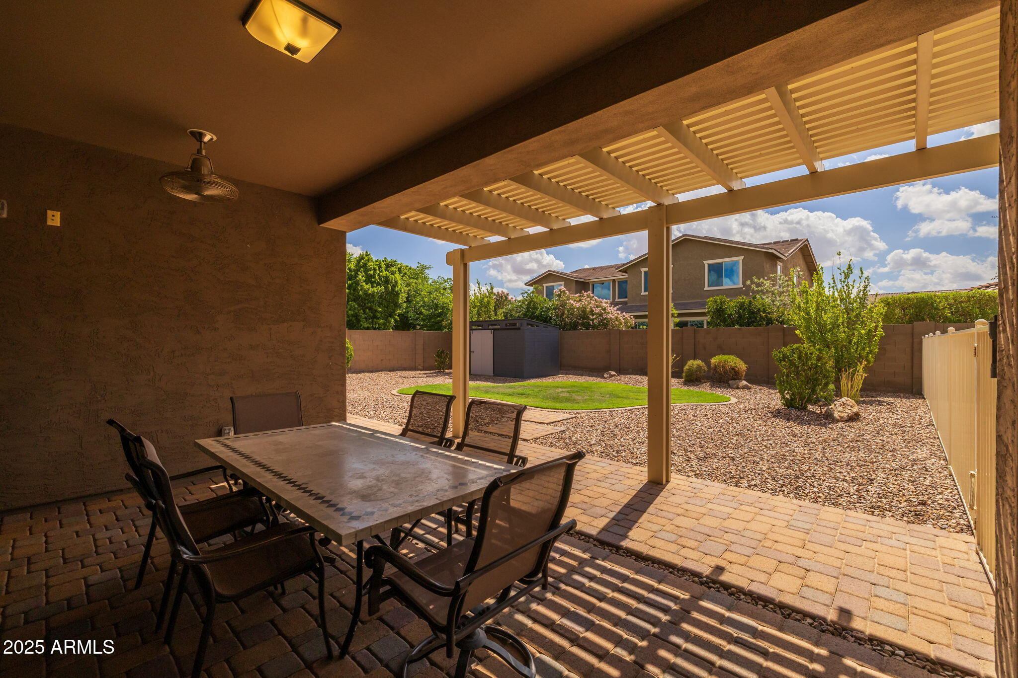 10535 Diffraction Avenue Mesa, AZ 85212 - Photo 77 of 126 a view of a patio with a table and chairs