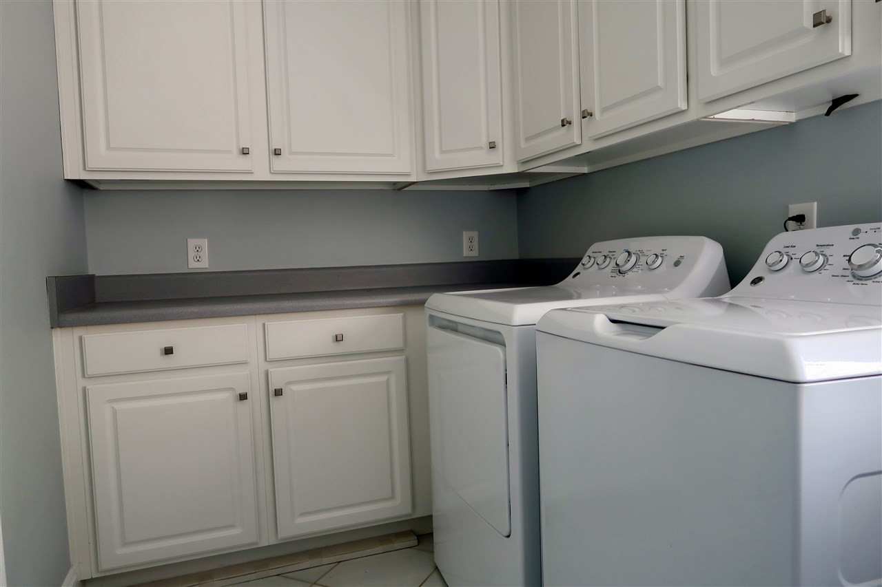 2815 Van Dyke Avenue Raleigh, NC 27607 - Photo 12 of 30 This laundry room has space and storage galore! There is also a utility sink on the other side of the room. Laundry Room