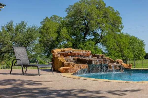 an outdoor space with furniture and garden