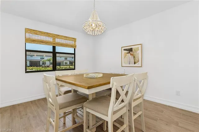 a dining room with furniture and a window