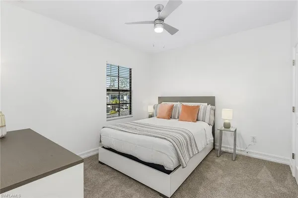 a bedroom with a bed and a book shelf