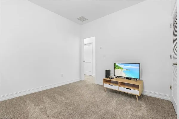 a room with a table and a potted plant