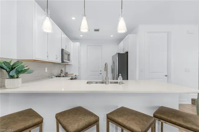 a kitchen with a table and chairs in it