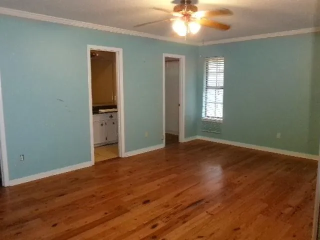 a bathroom with a granite countertop bathtub and toilet