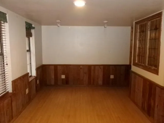 a kitchen with granite countertop a sink cabinets and window