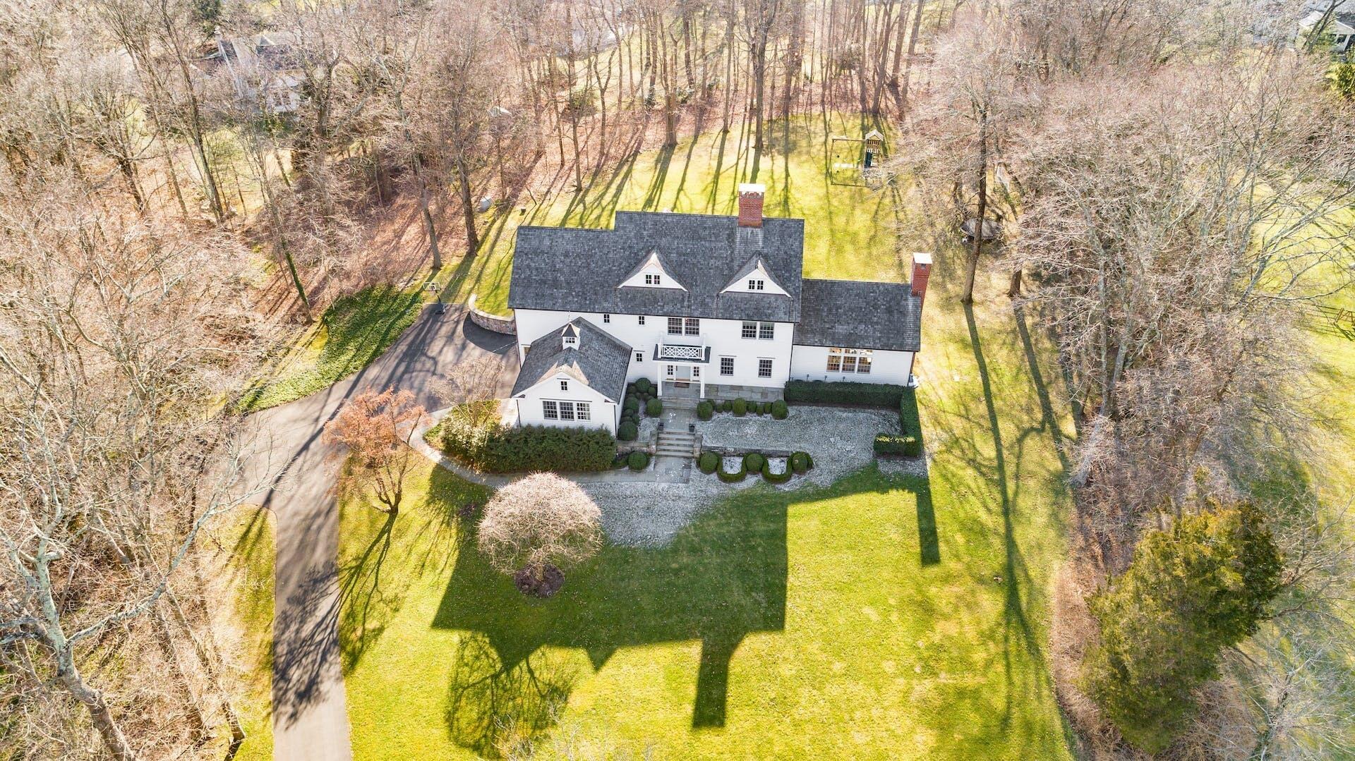 100 Pembroke Road Darien, CT 06820 - Photo 2 of 43 a view of swimming pool with a patio