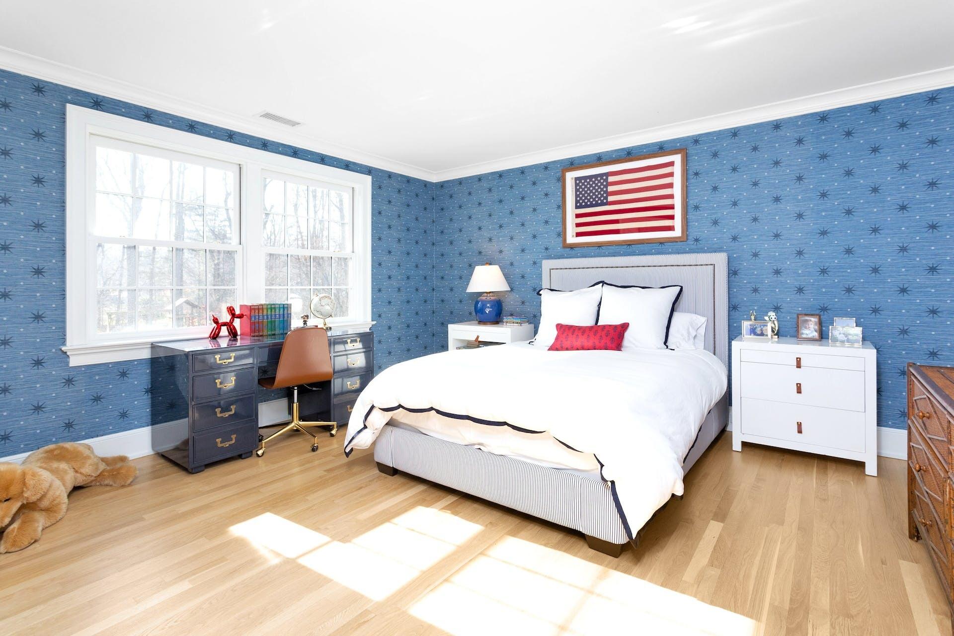 100 Pembroke Road Darien, CT 06820 - Photo 30 of 43 a bedroom with a bed and wooden floor
