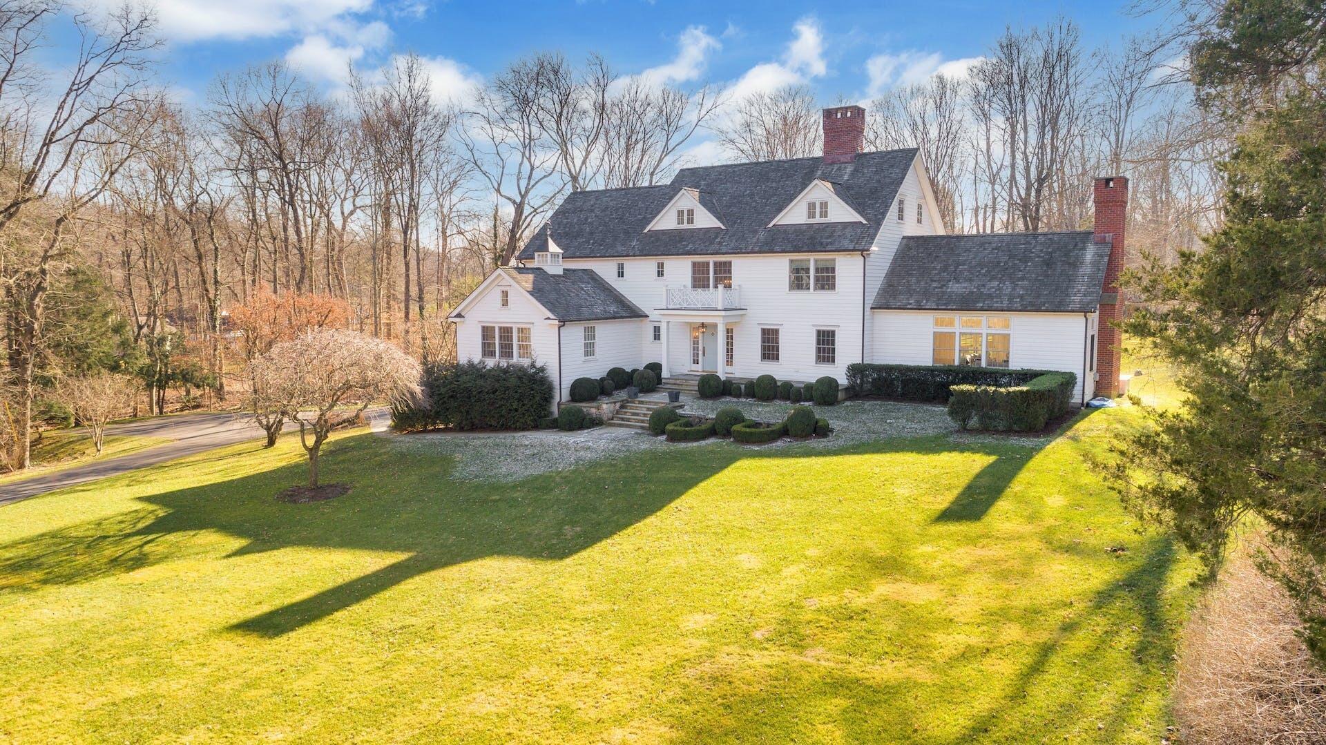 100 Pembroke Road Darien, CT 06820 - Photo 3 of 43 a view of a house with a swimming pool