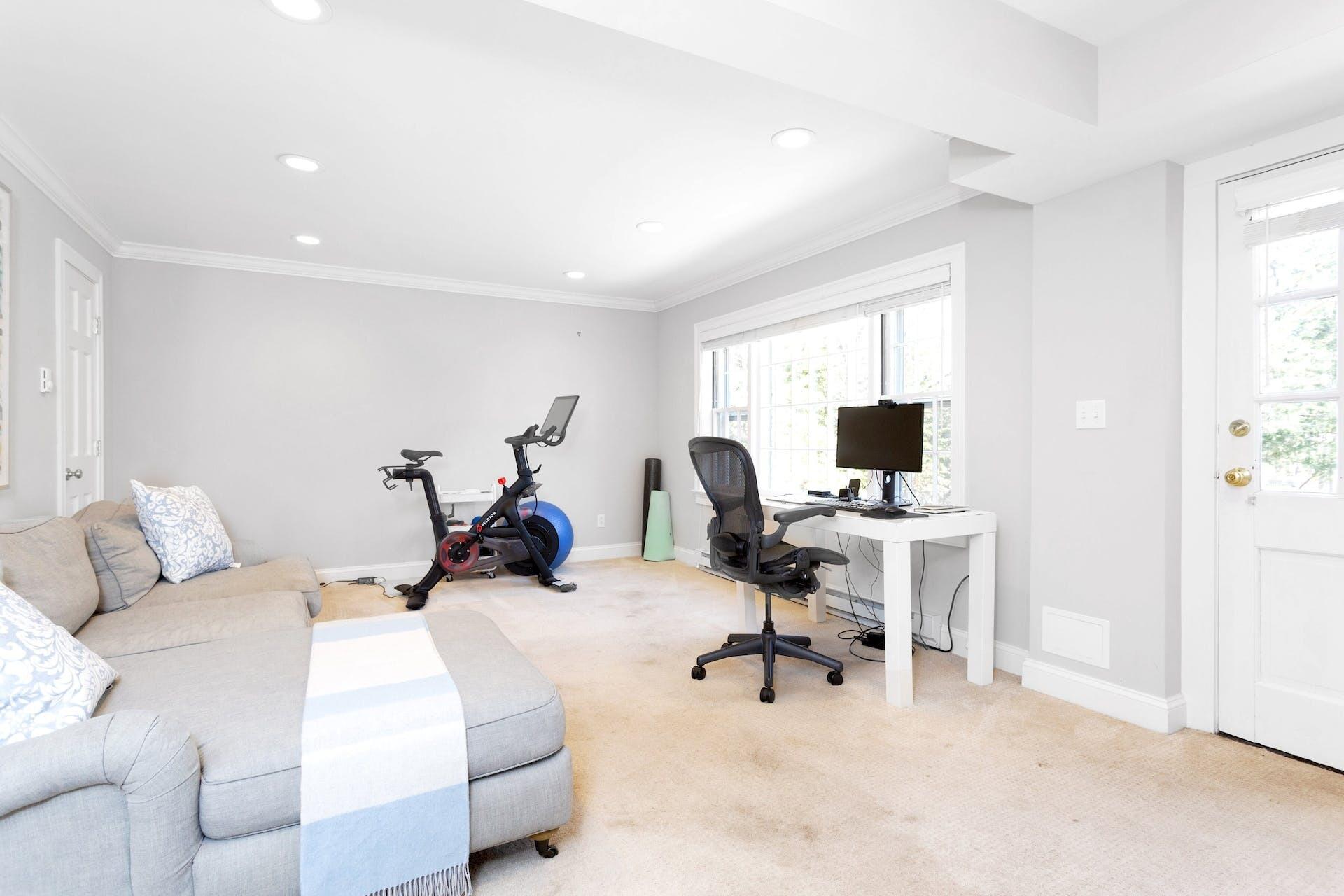 100 Pembroke Road Darien, CT 06820 - Photo 34 of 43 a bedroom with a bed and a desk