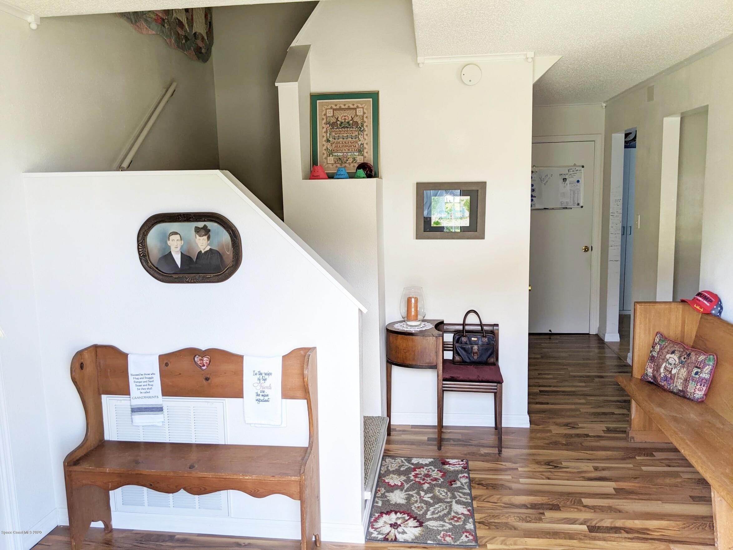3542 Brevard Road Mims, FL 32754 - Photo 22 of 66 a living room with furniture and a clock