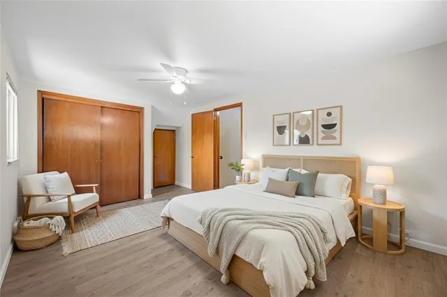 a spacious bedroom with a bed and furniture