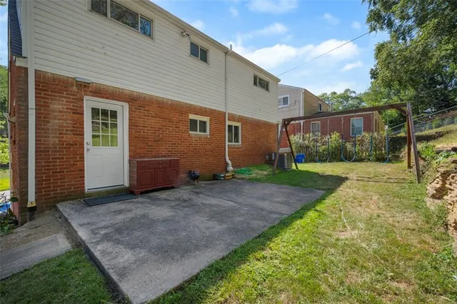 a view of a back yard of the house