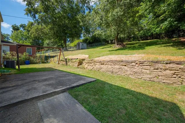 a view of a park with large trees