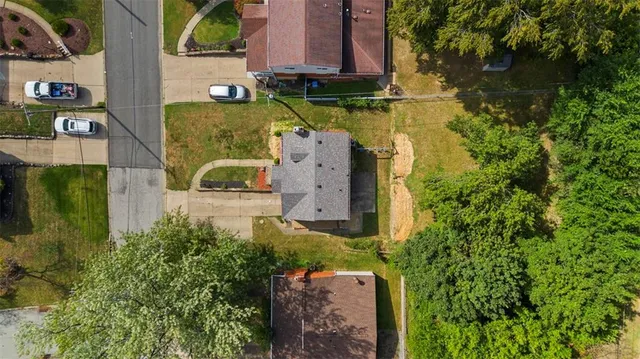 an aerial view of houses with yard