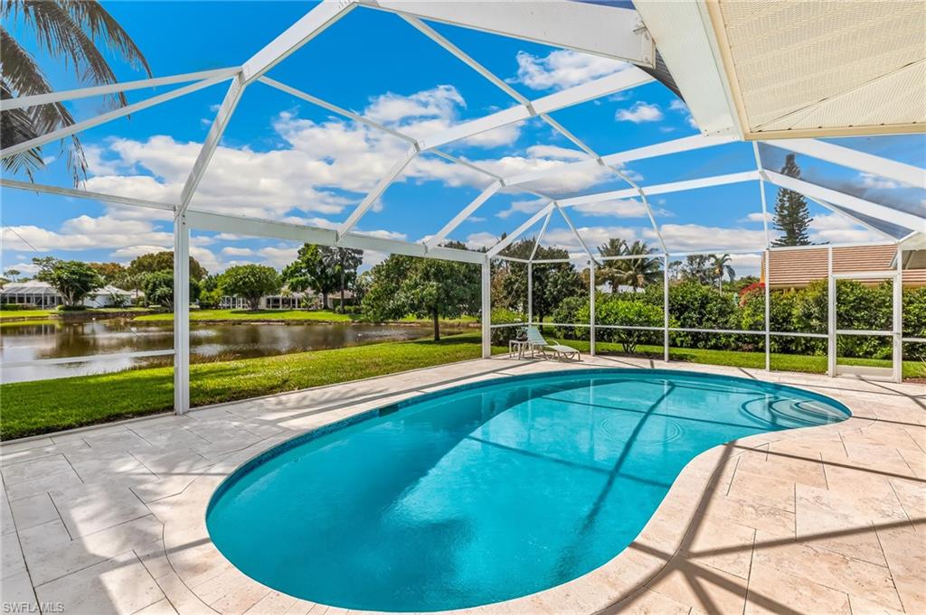 1904 Countess Court Naples, FL 34110 - Photo 19 of 33 a view of a backyard with swimming pool
