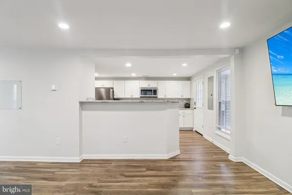 a view of kitchen with wooden floor