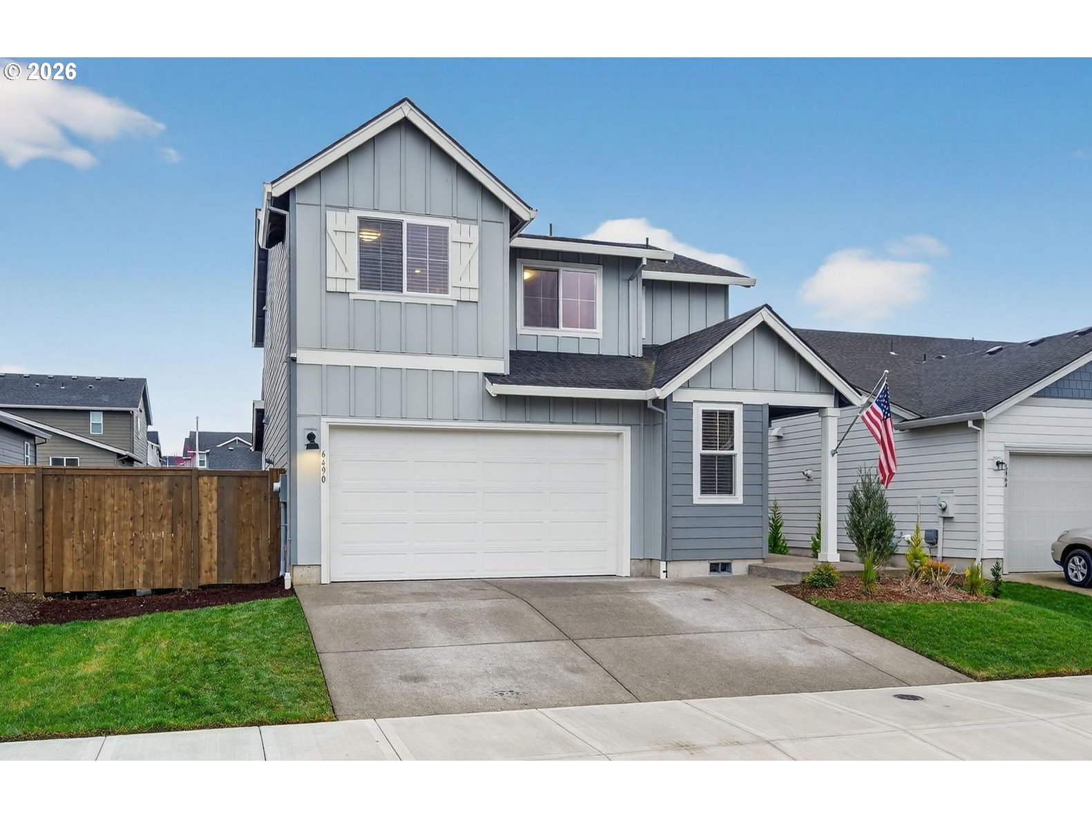 6490 Southeast 21st Terrace Gresham, OR 97080 - Photo 1 of 41 a front view of a house with a yard and garage
