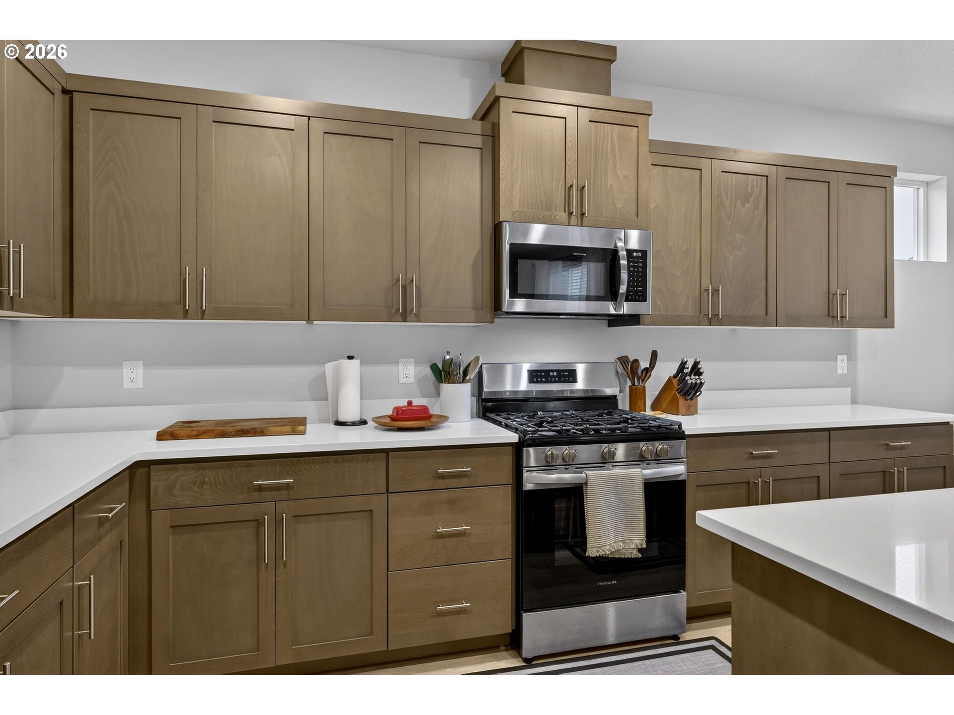 6490 Southeast 21st Terrace Gresham, OR 97080 - Photo 13 of 41 a kitchen with stainless steel appliances a stove microwave and sink