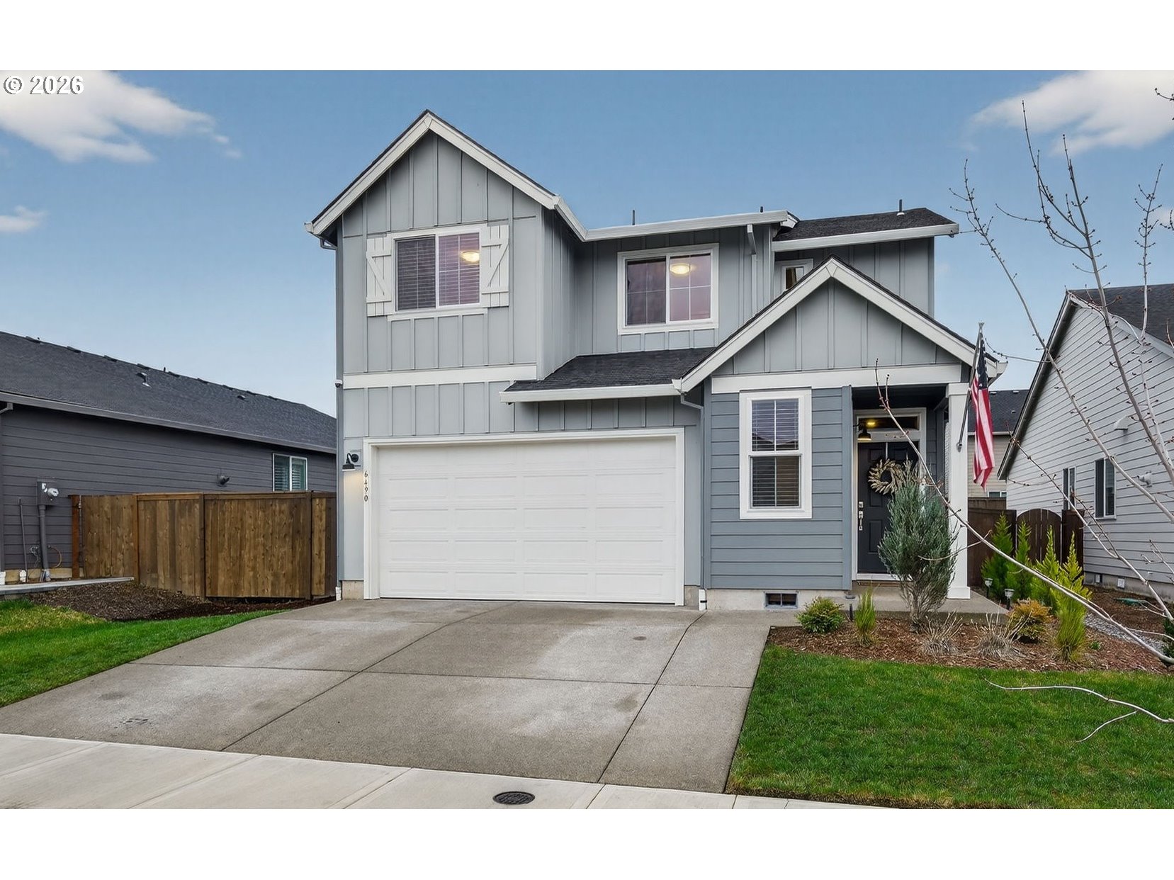 6490 Southeast 21st Terrace Gresham, OR 97080 - Photo 2 of 41 a front view of a house with a yard and garage