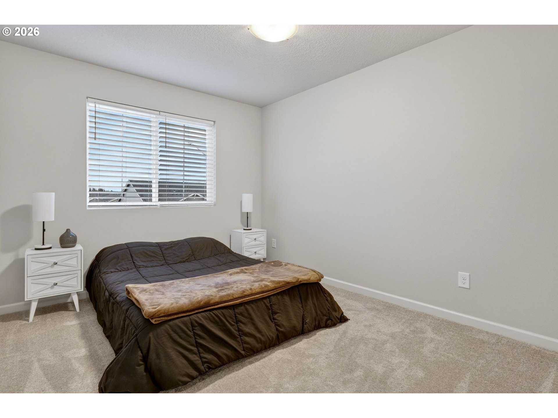 6490 Southeast 21st Terrace Gresham, OR 97080 - Photo 29 of 41 a bedroom with a bed window and a chair