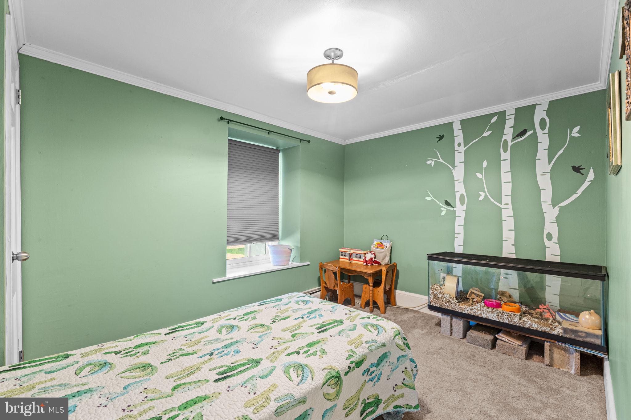 120 Alackness Road Spring City, PA 19475 - Photo 36 of 53 a bedroom with a bed and a chandelier