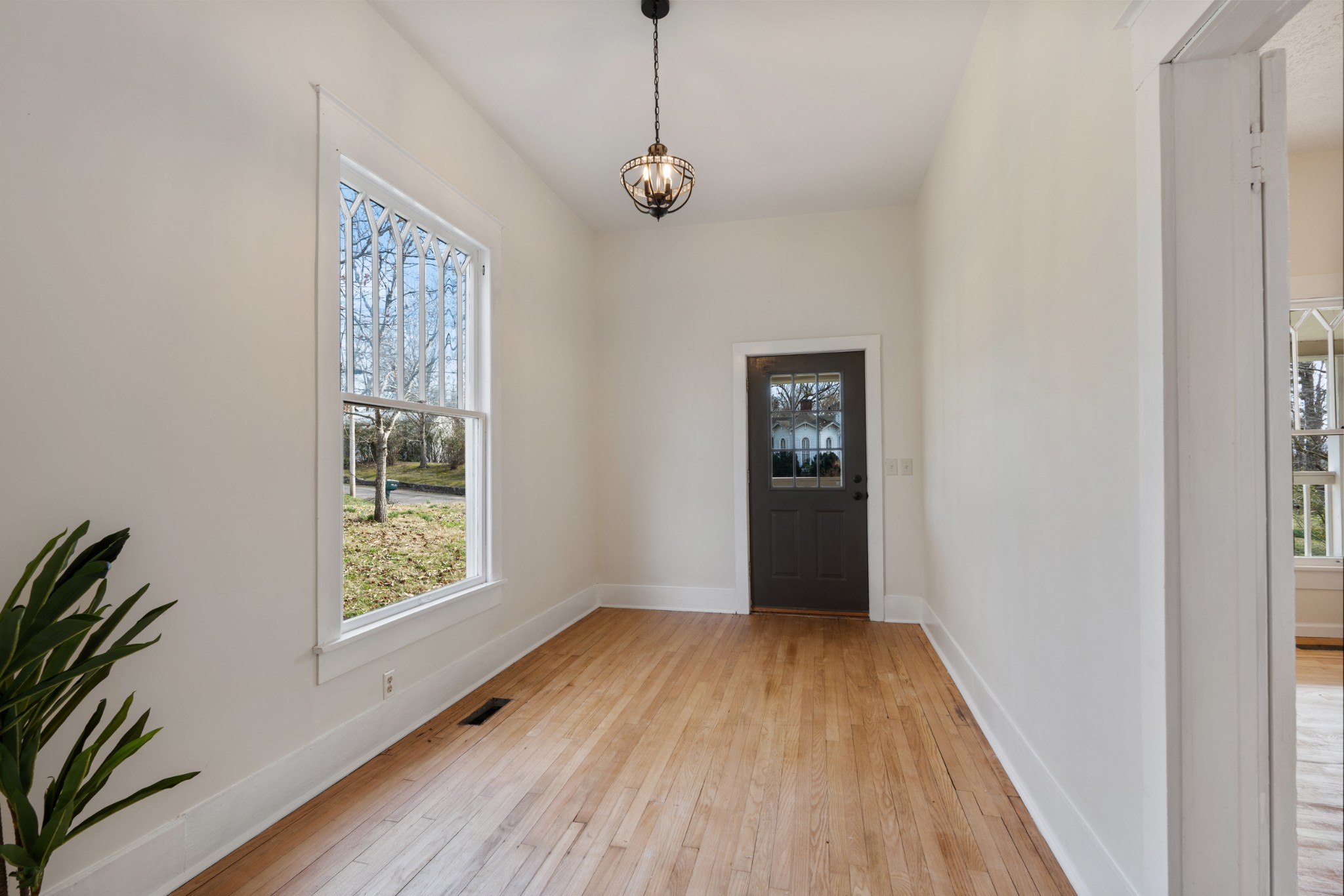 126 West End Avenue Centerville, TN 37033 - Photo 11 of 37 a view of a hallway with wooden floor and a window