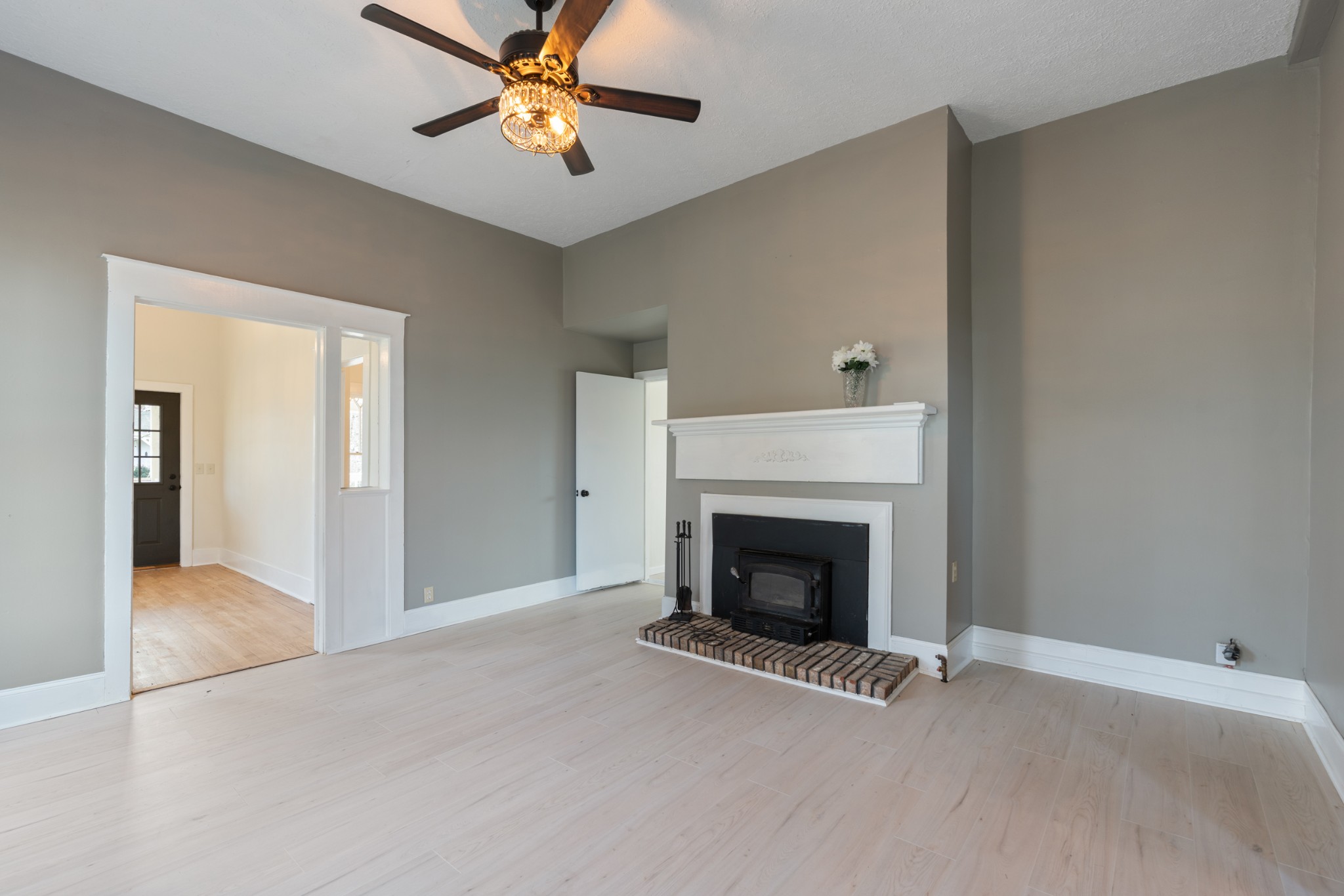 126 West End Avenue Centerville, TN 37033 - Photo 12 of 37 a view of an empty room with chandelier fan and fire place