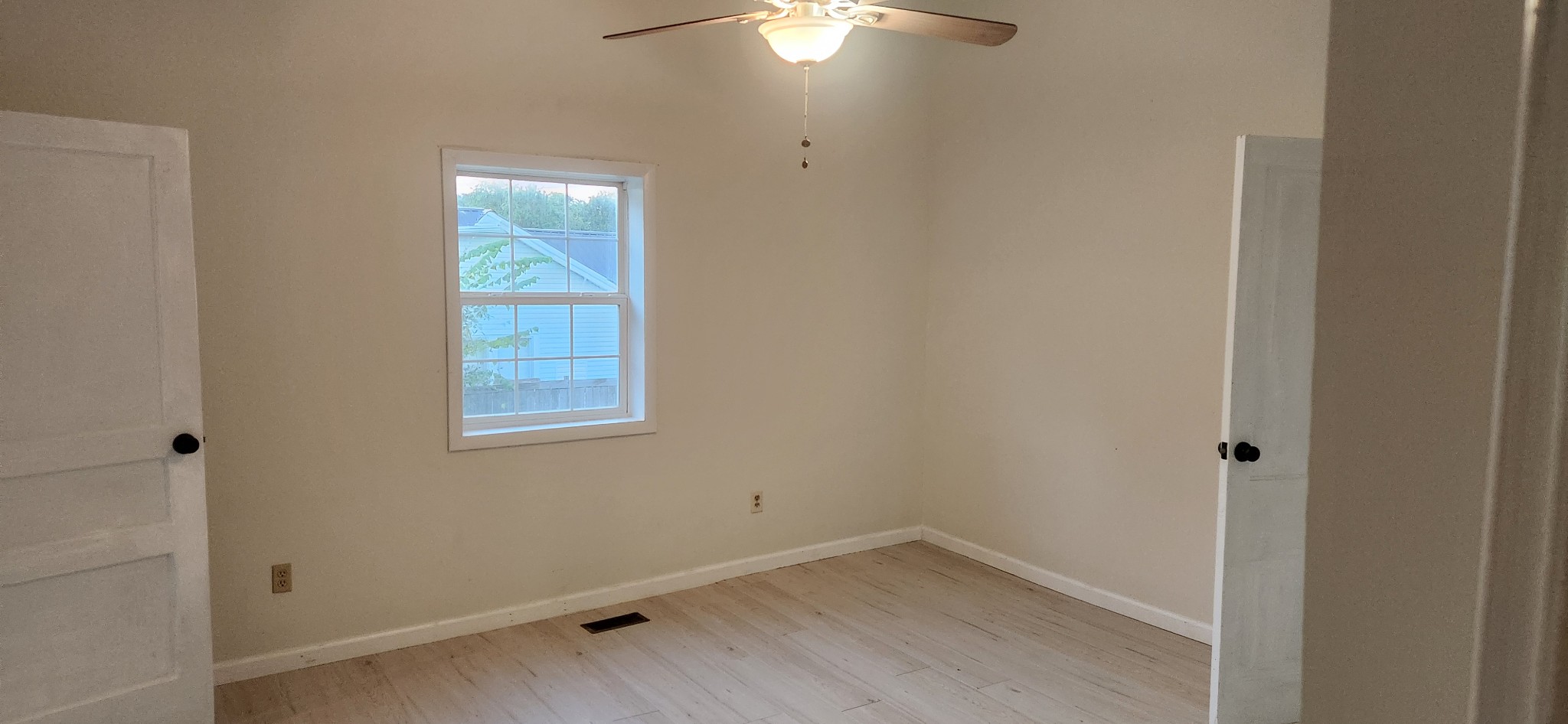 126 West End Avenue Centerville, TN 37033 - Photo 16 of 28 an empty room with a window and a fan
